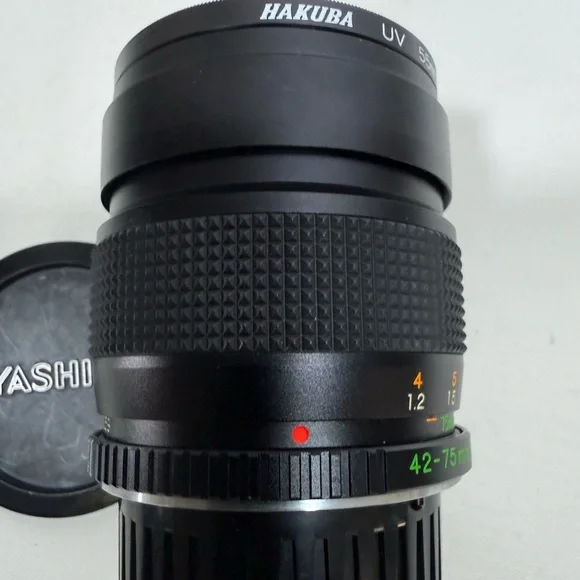 Yashica Zoom Lens 42- 75mm with case & Hakuba uv 55mm lens